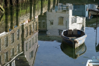 Reflections of boats and buildings