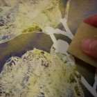 After the watercolor wash is totally dry you can remove the dry art masking fluid with a crepe eraser