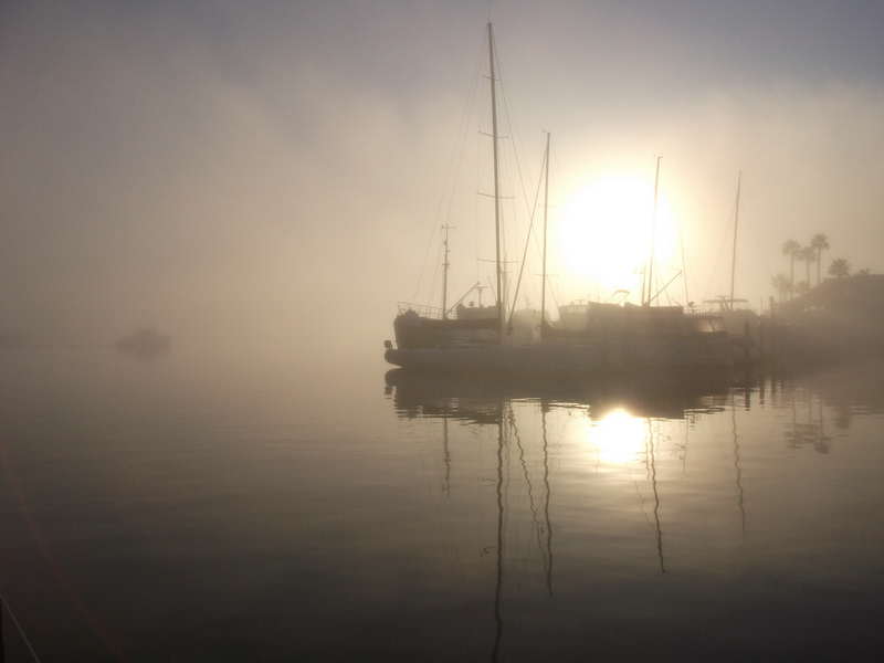 Watercolor painting of boats and mist